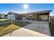 Brick and gray house with driveway and covered carport at 2310 Fairgren Ave, Deltona, FL 32738