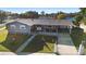 Front view of the house with landscaping and driveway at 2310 Fairgren Ave, Deltona, FL 32738