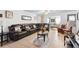 Living room features sectional sofa, ceiling fan, and wood coffee table at 2310 Fairgren Ave, Deltona, FL 32738