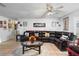 Spacious living room featuring a large sectional sofa and a coffee table at 2310 Fairgren Ave, Deltona, FL 32738