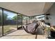Covered patio with screened enclosure and outdoor furniture at 2310 Fairgren Ave, Deltona, FL 32738