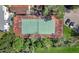 Aerial view of a tennis court nestled in a community setting at 2504 Woodgate Blvd # 107, Orlando, FL 32822