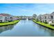 Scenic view of a tranquil canal with residential buildings along the water at 2504 Woodgate Blvd # 107, Orlando, FL 32822