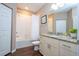 Clean, simple bathroom with white shower and granite countertop vanity at 2901 Edenshire Way # 104, Kissimmee, FL 34746