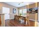 Dining area featuring a wooden table, chairs, and wall decor at 2901 Edenshire Way # 104, Kissimmee, FL 34746