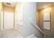 Hallway with doors to bedrooms, and a staircase at 2901 Edenshire Way # 104, Kissimmee, FL 34746