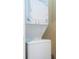 Convenient stacked washer and dryer unit for laundry needs at 2901 Edenshire Way # 104, Kissimmee, FL 34746