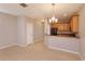 Dining room adjacent to kitchen with tile flooring and light walls at 3262 Villa Strada Way, Orlando, FL 32835