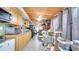 Long kitchen with light wood cabinets and ample counter space at 405 Mallard Ln, Kissimmee, FL 34759