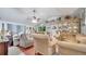 Living room with two beige sofas and a large wooden hutch at 405 Mallard Ln, Kissimmee, FL 34759