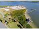 Drone view showcasing waterfront property and pier access at 500 S Riverside Dr, Edgewater, FL 32132