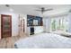 Spacious main bedroom with light wood floors, king bed, and water views at 500 S Riverside Dr, Edgewater, FL 32132