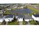 Aerial view of a house near a pond at 5427 Hanover Square Dr, St Cloud, FL 34771