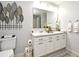 Modern bathroom with a double vanity and elegant wall decor at 5427 Hanover Square Dr, St Cloud, FL 34771