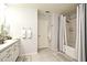 Bathroom with a bathtub, double vanity, and neutral decor at 5427 Hanover Square Dr, St Cloud, FL 34771
