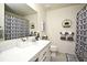 Clean bathroom with a shower/tub combo, vanity, and patterned curtain at 5427 Hanover Square Dr, St Cloud, FL 34771