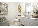 Elegant bathroom featuring a floating vanity, decorative accents, and toilet at 5427 Hanover Square Dr, St Cloud, FL 34771