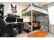 Stylish bedroom with a built-in bunk bed, workspace, and colorful accents at 5427 Hanover Square Dr, St Cloud, FL 34771