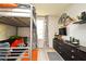Spacious bedroom featuring a bunk bed, dresser, and TV at 5427 Hanover Square Dr, St Cloud, FL 34771