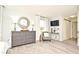 Main bedroom with a dresser, seating area, and TV at 5427 Hanover Square Dr, St Cloud, FL 34771