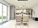 Dining area with glass table and chairs, near the kitchen at 5427 Hanover Square Dr, St Cloud, FL 34771