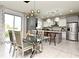 Bright dining room with glass table and chairs near kitchen at 5427 Hanover Square Dr, St Cloud, FL 34771