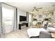 Spacious Gathering room with large windows, comfy seating, and built-in shelving at 5427 Hanover Square Dr, St Cloud, FL 34771