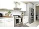 Modern kitchen with stainless steel appliances and granite countertops at 5427 Hanover Square Dr, St Cloud, FL 34771