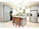 Modern kitchen with gray and white cabinets and island at 5427 Hanover Square Dr, St Cloud, FL 34771