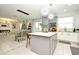 Modern kitchen with an island, stainless steel appliances, and ample counter space at 5427 Hanover Square Dr, St Cloud, FL 34771