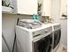 Laundry room with washer, dryer, and ample storage at 5427 Hanover Square Dr, St Cloud, FL 34771