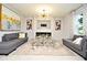 Spacious living room featuring a fireplace and large windows at 5427 Hanover Square Dr, St Cloud, FL 34771