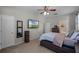 Bright bedroom with a large TV, dresser, and ensuite bathroom access at 842 Cherry Valley Way, Orlando, FL 32828