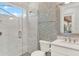 Modern bathroom with glass shower, marble tile, and stylish fixtures at 10852 Mobberley Cir, Orlando, FL 32832