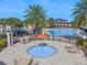 Community pool with splash pad, lounge chairs, and clubhouse at 10852 Mobberley Cir, Orlando, FL 32832