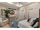 Main bedroom with sitting area and access to bathroom at 12133 Grand Oak Ln, Oxford, FL 34484