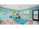 Fitness center with equipment and yoga mats at 12133 Grand Oak Ln, Oxford, FL 34484