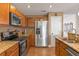 Kitchen with stainless steel appliances and granite countertops at 14638 Tullamore Loop, Winter Garden, FL 34787