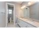 Bathroom with double vanity, large mirror, and shower at 15730 Cutter Sail Pl, Winter Garden, FL 34787