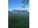 View of the back of a single-story home with a large grassy backyard at 1704 Osceola Park Dr, Kissimmee, FL 34741