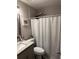 Stylish bathroom with a granite countertop, a shower, and modern fixtures at 1704 Osceola Park Dr, Kissimmee, FL 34741