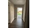 Entryway or foyer with wood-look laminate floors and a view to the front yard at 1704 Osceola Park Dr, Kissimmee, FL 34741