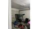 Garage interior with porch swing, lawnmower, and storage items at 1704 Osceola Park Dr, Kissimmee, FL 34741