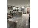 Modern kitchen featuring white shaker cabinets, stainless steel appliances, and an island at 1704 Osceola Park Dr, Kissimmee, FL 34741