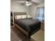Relaxing Primary bedroom with wood-look flooring and neutral decor at 1704 Osceola Park Dr, Kissimmee, FL 34741