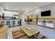 Open living room and kitchen with modern design at 17417 Placidity Ave, Clermont, FL 34714