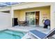 Private pool and patio with seating and grill at 17417 Placidity Ave, Clermont, FL 34714