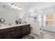 Elegant bathroom with double vanity and a glass shower at 236 Denali St, Haines City, FL 33844