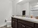 Bathroom with double vanity and dark brown cabinets at 236 Denali St, Haines City, FL 33844