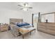 Spacious bedroom with large bed, dresser, and ceiling fan at 236 Denali St, Haines City, FL 33844